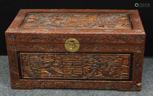 A Chinese inspired hardwood blanket chest, profusely applied with dragons, birds, character marks,
