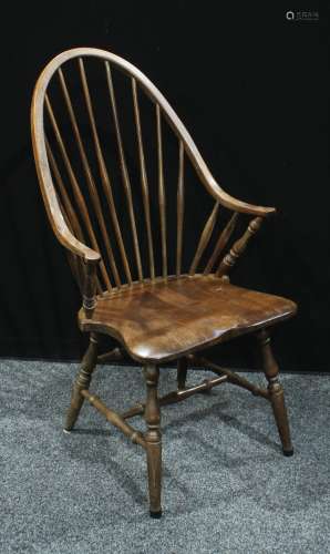 A spindle back kitchen chair, saddle seat, turned supports, 104cm high