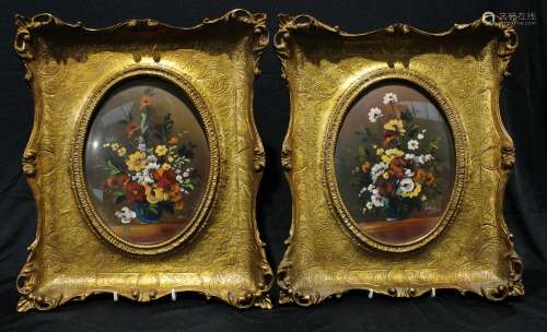 A pair of still life paintings, flowers in vases, oil, indistinctly signed, each 23cm x 17.5cm (2)