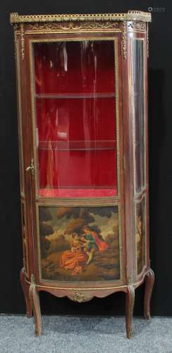 A Louis XV style gilt metal mounted mahogany shaped serpentine vitrine, pierced gallery above a