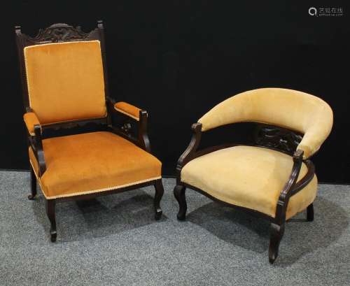 A late Victorian/Edwardian Eastlake style open armchair; a similar club/tub armchair (2)