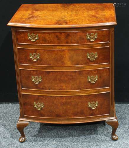 A Queen Anne style walnut chest of drawers, bow-front top above four cockbeaded graduated drawers,