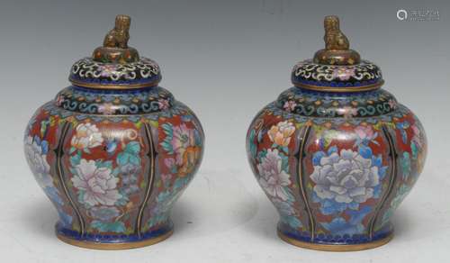 A pair of Chinese cloisonne baluster jars and covers, gilt temple lion finials, decorated in