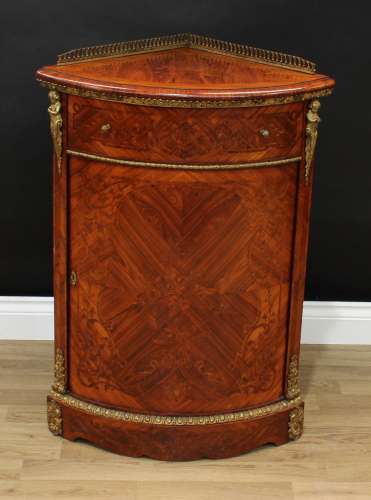 A French Louis XVI Revival gilt metal mounted kingwood and marquetry corner floor cabinet, pierced