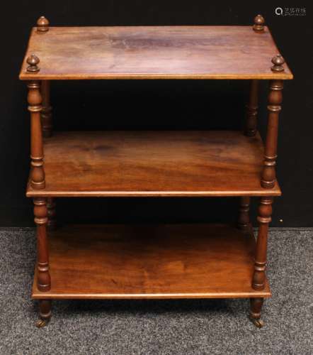 A Victorian oak three tire whatnot/open bookcase, turned supports, Labelled J.Mathews & Sons,