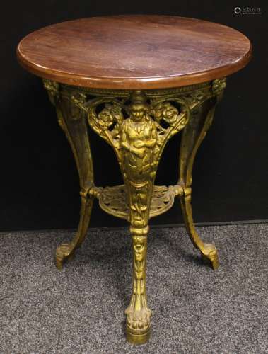 A cast iron and oak 'abolitionist' pub table, circular top, 74cm high, 59cm diamete.