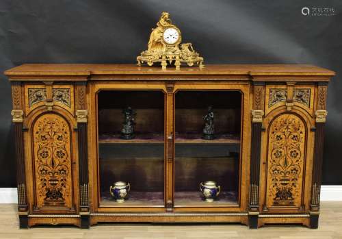 A Victorian parcel-gilt amboyna and marquetry inverted break-centre library side cabinet, in the