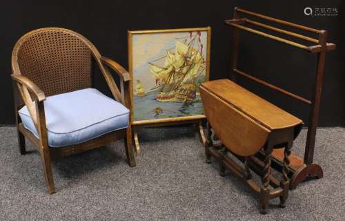 A 20th century oak drawing room clue chair, cane back; 72cm; an oak drop leaf table, barley twist