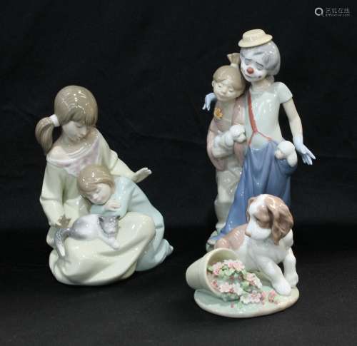 A Lladro figure group, two sisters and a kitten; a Lladro Society model 2000, Clown with girl and