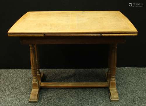 An oak refectory type draw-leaf dining table