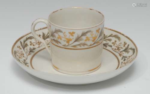 A Pinxton coffee can and saucer, pattern 275, decorated with scrolling leaves in tones of grey and
