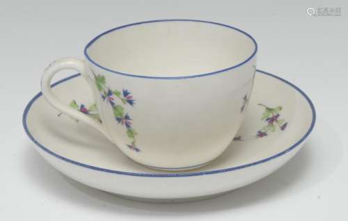 A Pinxton teacup and saucer, pattern 13, decorated with chantilly sprigs, blue line rims, 1796 -