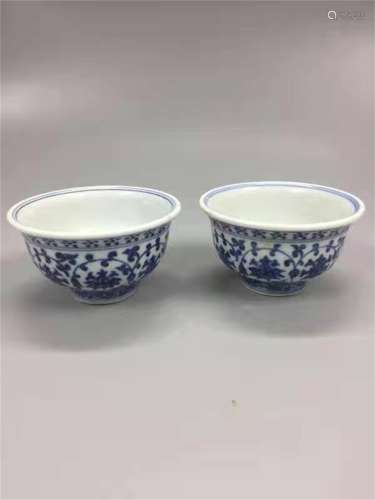 A PAIR OF MING DYNASTY YONGLE BLACK AND WHITE CUPS