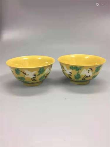 A PAIR OF QING DYNASTY YONGZHENG YELLOW GROUND CARVED CUPS