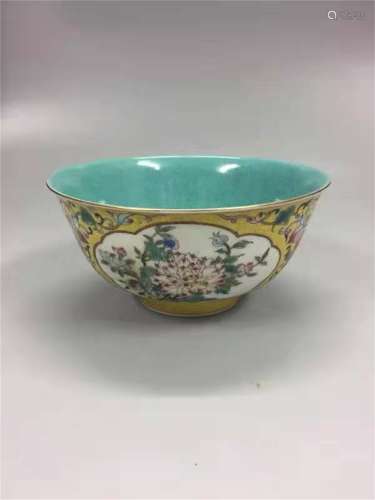 A QING DYNASTY YONGZHENG YELLOW GROUND FAMILLE ROSE CUP