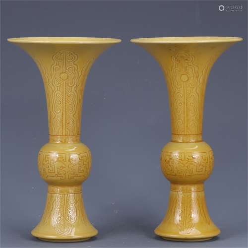A pair of yellow glazed Goblets