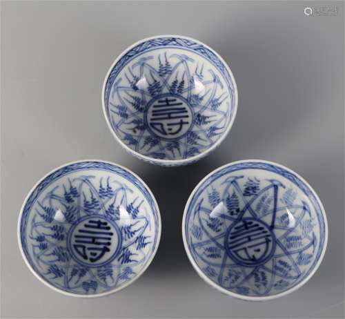 Three blue and white bowls with longevity
