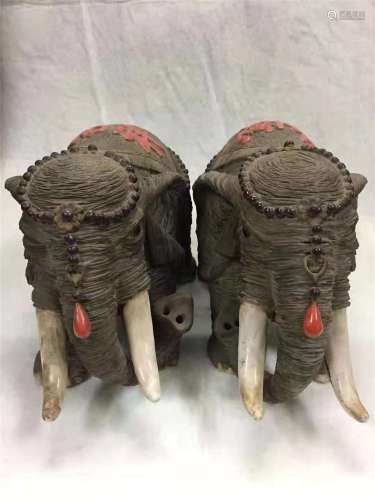 A PAIR OF MIN GUO PERIOD ELEPHANT CLAY STATUES