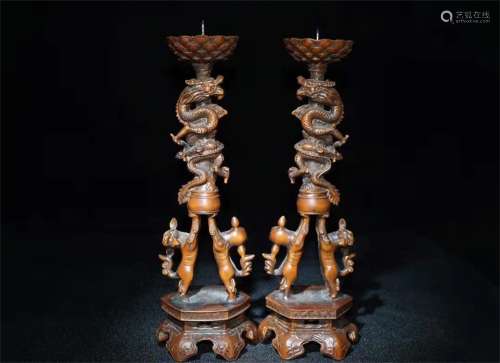 A PAIR OF BOXWOOD CARVED CANDELSTICKS