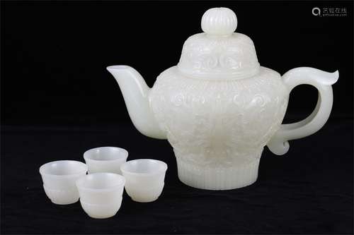 A set of jade white jade palace carving tea pot and cup