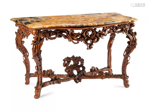 An Italian Rococo Carved Walnut Marble-Top Console