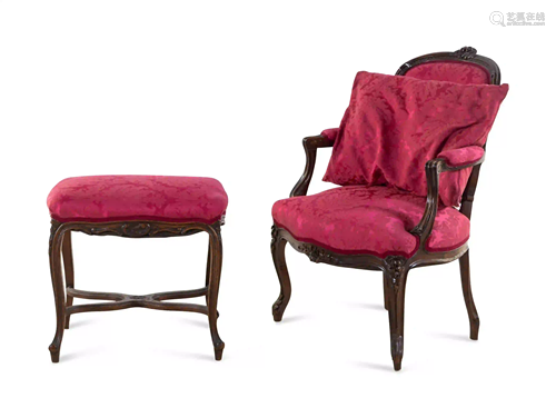 A Louis XV Style Carved Walnut Fauteuil and Tabouret