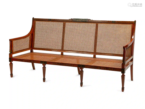 An Edwardian Painted Satinwood Caned Settee