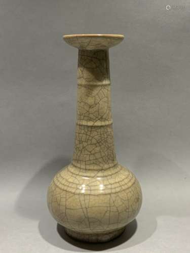 Yellow glazed long necked bottle with string pattern