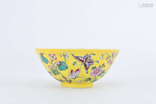 A YELLOW-GROUND FAMILLE ROSE BUTTERFLY AND FLOWER PORCELAIN BOWL
