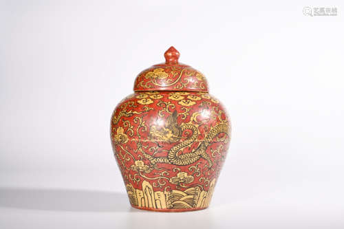 AN IRON GROUND YELLOW DRAGON PORCELAIN JAR AND COVER