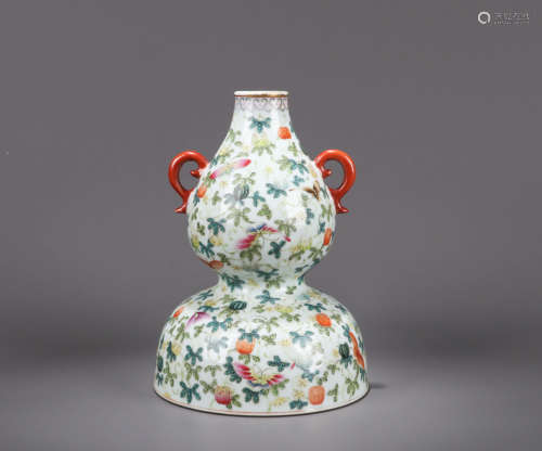 A FAMILLE ROSE BUTTERFLY AND FLOWER PORCELAIN GOURD-SHAPED VASE