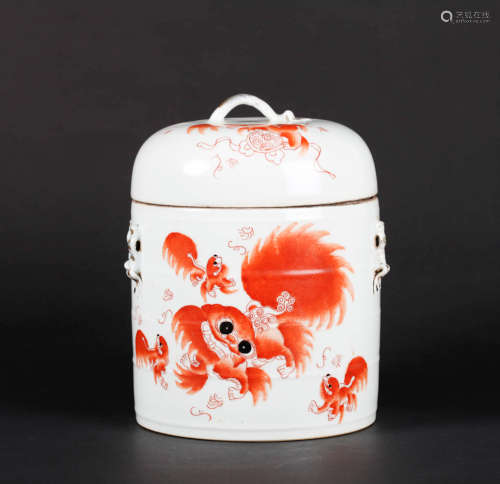 AN IRON RED LION PORCELAIN JAR AND COVER
