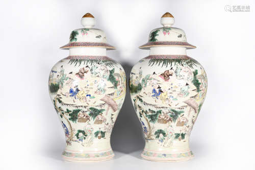 A PAIR OF FAMILLE ROSE FIGURE PORCELAIN JARS AND COVERS