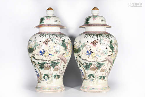 A PAIR OF FAMILLE ROSE FIGURE PORCELAIN JARS AND COVERS