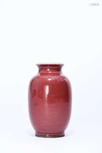 A RED GLAZED PORCELAIN LANTERN-SHAPED VASE