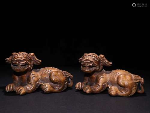 Pair Of Agarwood Beast Carved Ornaments