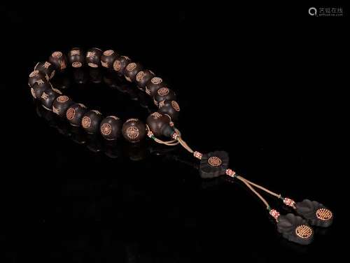 An Agarwood Gilt Silver 18-Bead Pendant