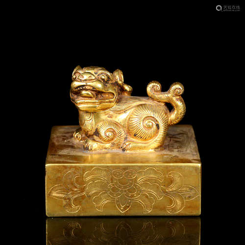 A GILD BRONZE BEAST HANDLE SEAL