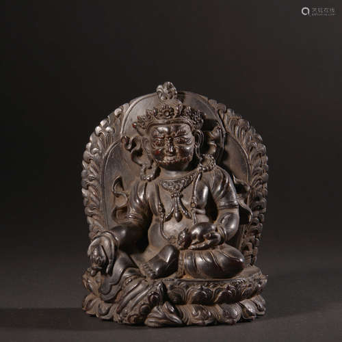 A RED SANDALWOOD CARVED STATUE OF THE YELLOW JAMBHALA