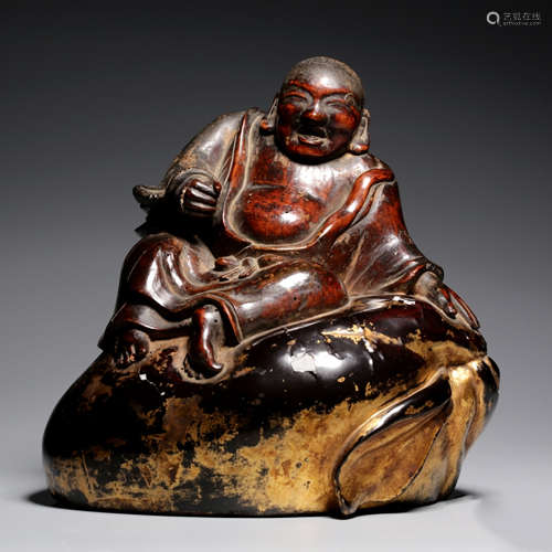 A GOLD LACQUER WOOD CARVED MONK ORNAMENT