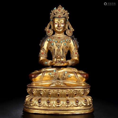 A GEM INLAID GILD BRONZE SEATED STATUE OF THE LONGEVITY GOD