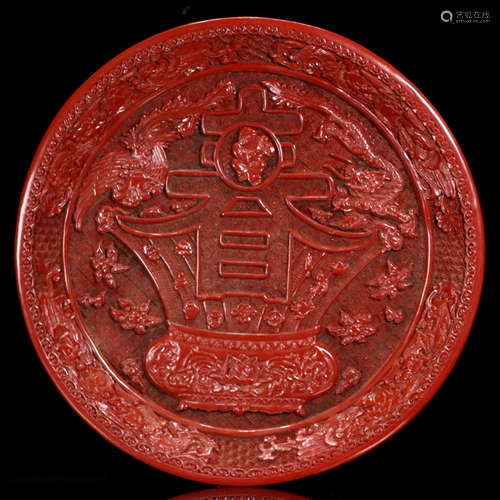 A FLORAL CARVED RED LACQUER PLATE