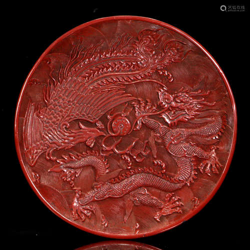 A DRAGON PHOENIX CARVED RED LACQUER PLATE