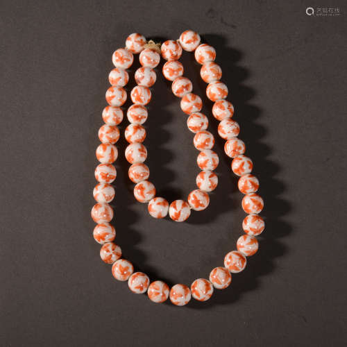 A CORAL RED COLORED PORCELAIN PRAYER BEADS