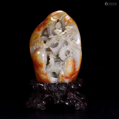 A WHITE JADE CARVED PEBBLE SKIN MOUNTAIN