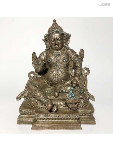 A SILVER-BRONZE FIGURE OF JAMBHALA