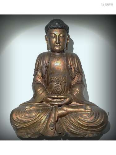 A WOODEN FIGURE OF SHAKYAMUNI