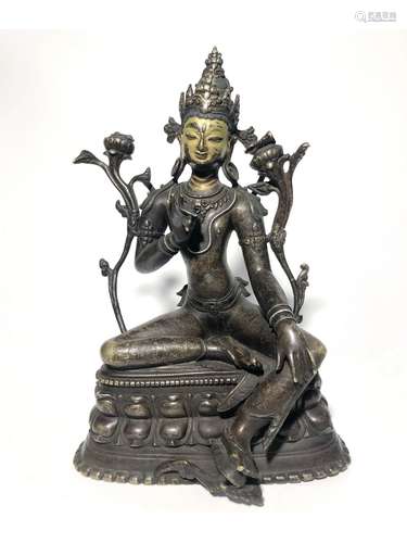 A GILT-BRONZE FIGURE OF TARA