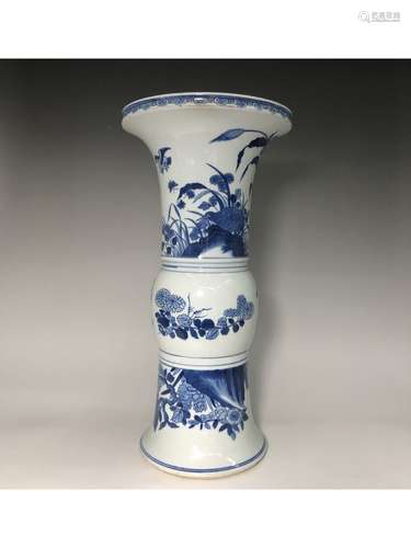 A BLUE AND WHITE BEAKER