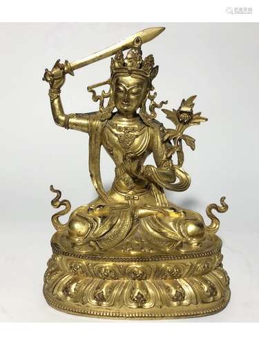 A GILT-BRONZE FIGURE OF MANJUSHRI